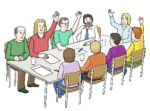 Viele Personen sitzen an einem Tisch, mehrere von ihnen heben eine Hand.